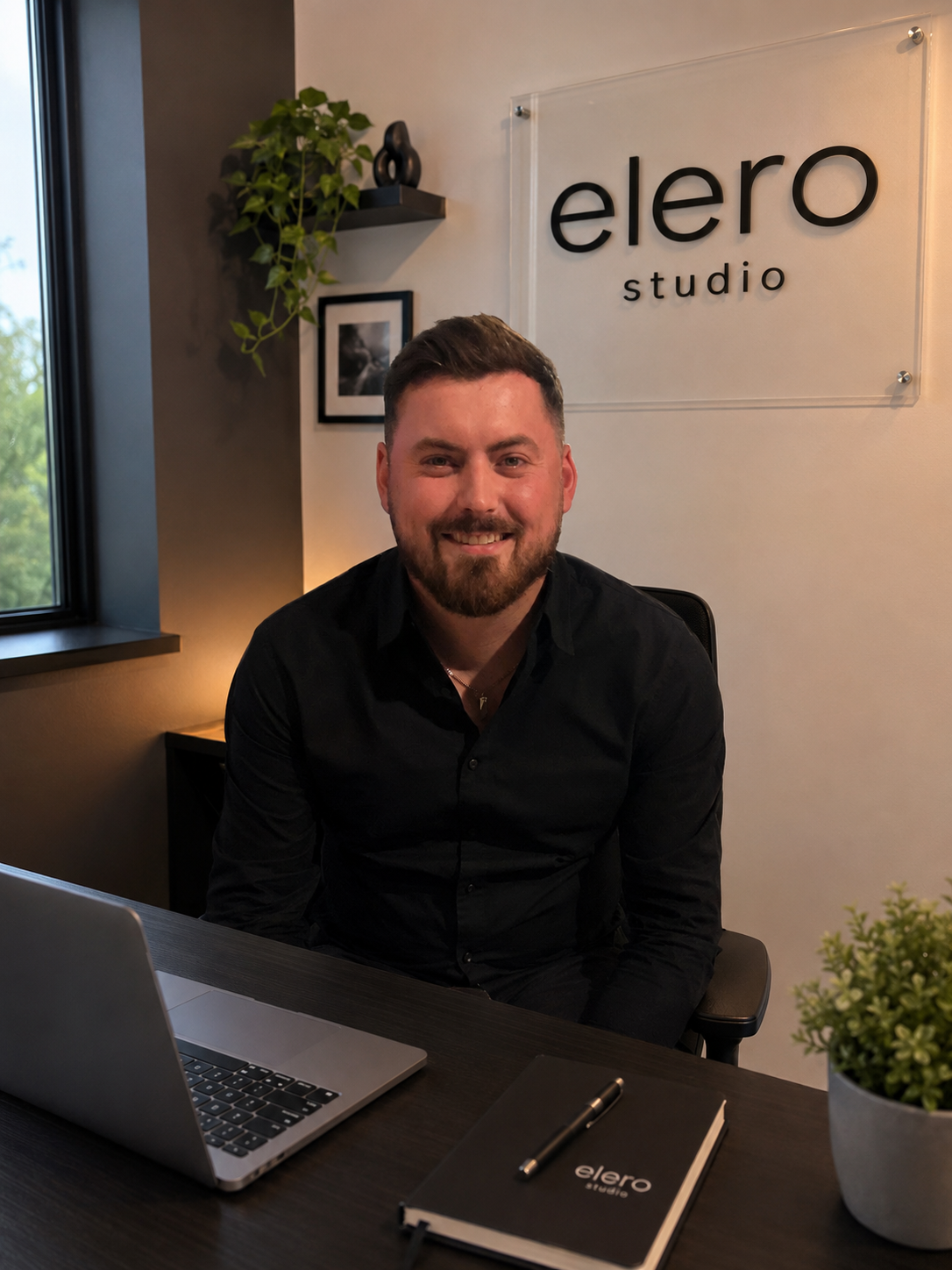 Ed from Elero Studio working at a desk